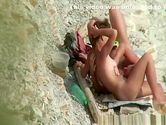 Nudist man gropes his woman's body