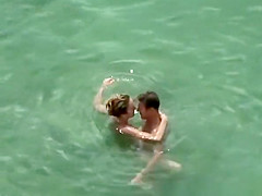 Nudist couple secretly filmed fucking in the water