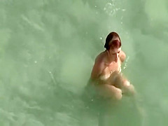 Young couple fucks in the water