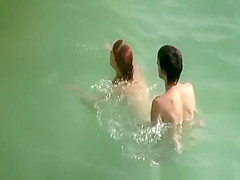 Young couple fucks in the water