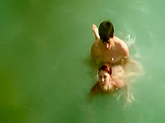 Young couple fucks in the water