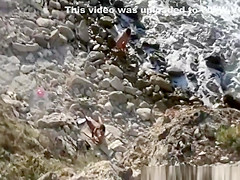 Skinny guy fucks girlfriend in rocky seashore