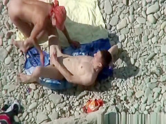 Busty nudist fucked at the beach