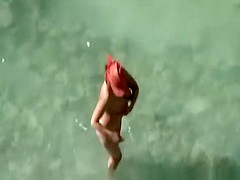 Busty nudist fucked at the beach