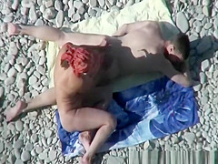 Busty nudist fucked at the beach