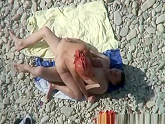 Busty nudist fucked at the beach