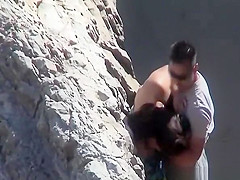 Couple playing with eachother at beach