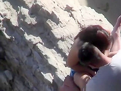 Couple playing with eachother at beach