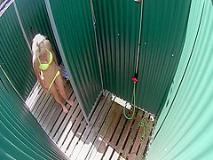 Mature lady spied in the beach shower