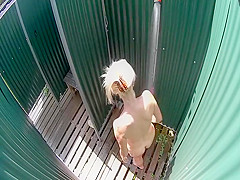 Mature lady spied in the beach shower