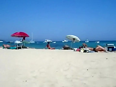 Secret view as she rubs pussy on a beach