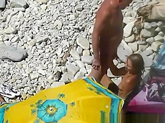 Nudist blows her standing man's penis