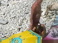 Nudist blows her standing man's penis