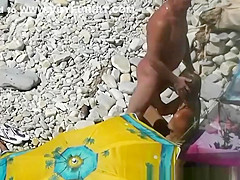 Nudist blows her standing man's penis