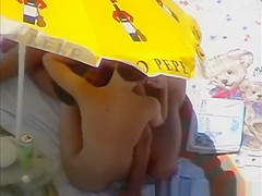 Nudists having sex under the sun umbrella