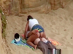 Chubby girl rides boyfriends cock in beach