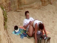 Chubby girl rides boyfriends cock in beach