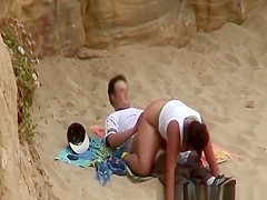 Chubby girl rides boyfriends cock in beach