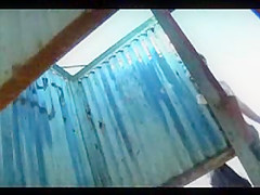 Woman changing at the beach