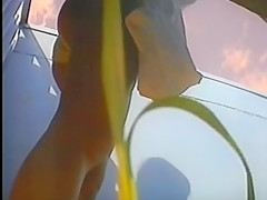 girl changing in beach cabin