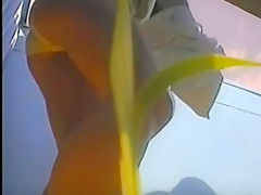 girl changing in beach cabin