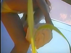 girl changing in beach cabin