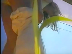 girl changing in beach cabin