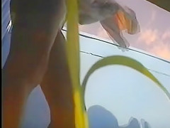 girl changing in beach cabin