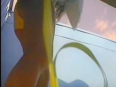 girl changing in beach cabin