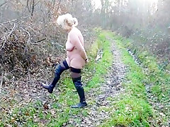 Woman naked in woodland