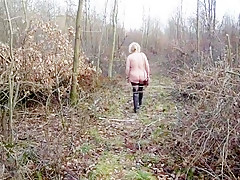 Woman naked in woodland