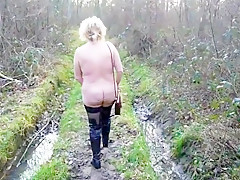 Woman naked in woodland