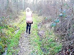Woman naked in woodland