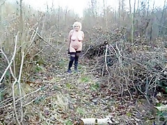 Woman naked in woodland