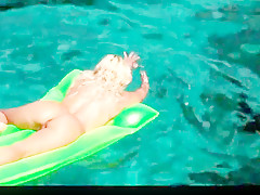 Hot blonde milf naked in ocean on public beach