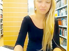 Blonde has fun in the library