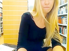 Blonde has fun in the library