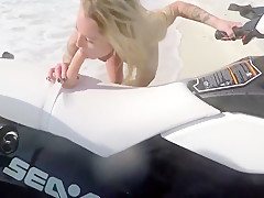 Beuatiful blonde toying her pussy on a jet ski