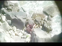 Secretly fuck on rocky beach