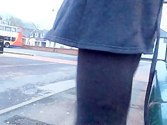 Tranny daring public bus station