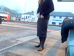 Tranny daring public bus station