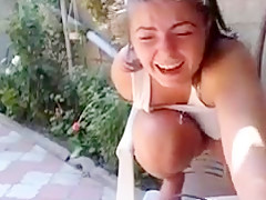 Chick bates and squirts on cam outdoors