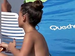 Beauty putting sunscreen on her mounds 1