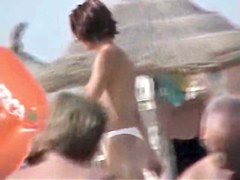 Naked tits proudly sticking for beach voyeur cam