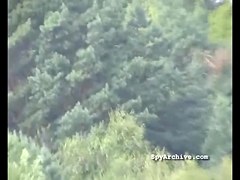 Spying on bare cuties widening their legs at the beach