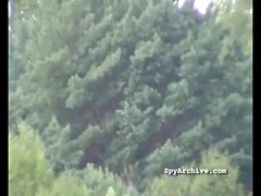 Spying on bare cuties widening their legs at the beach