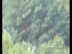 Spying on bare cuties widening their legs at the beach