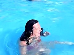 Sweet brunette doll has lost her bikini panty in the pool