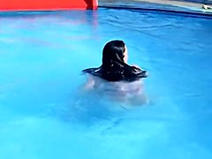 Sweet brunette doll has lost her bikini panty in the pool