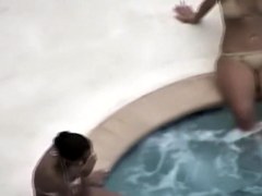 Big hips blonde in nude style bikini at the pool